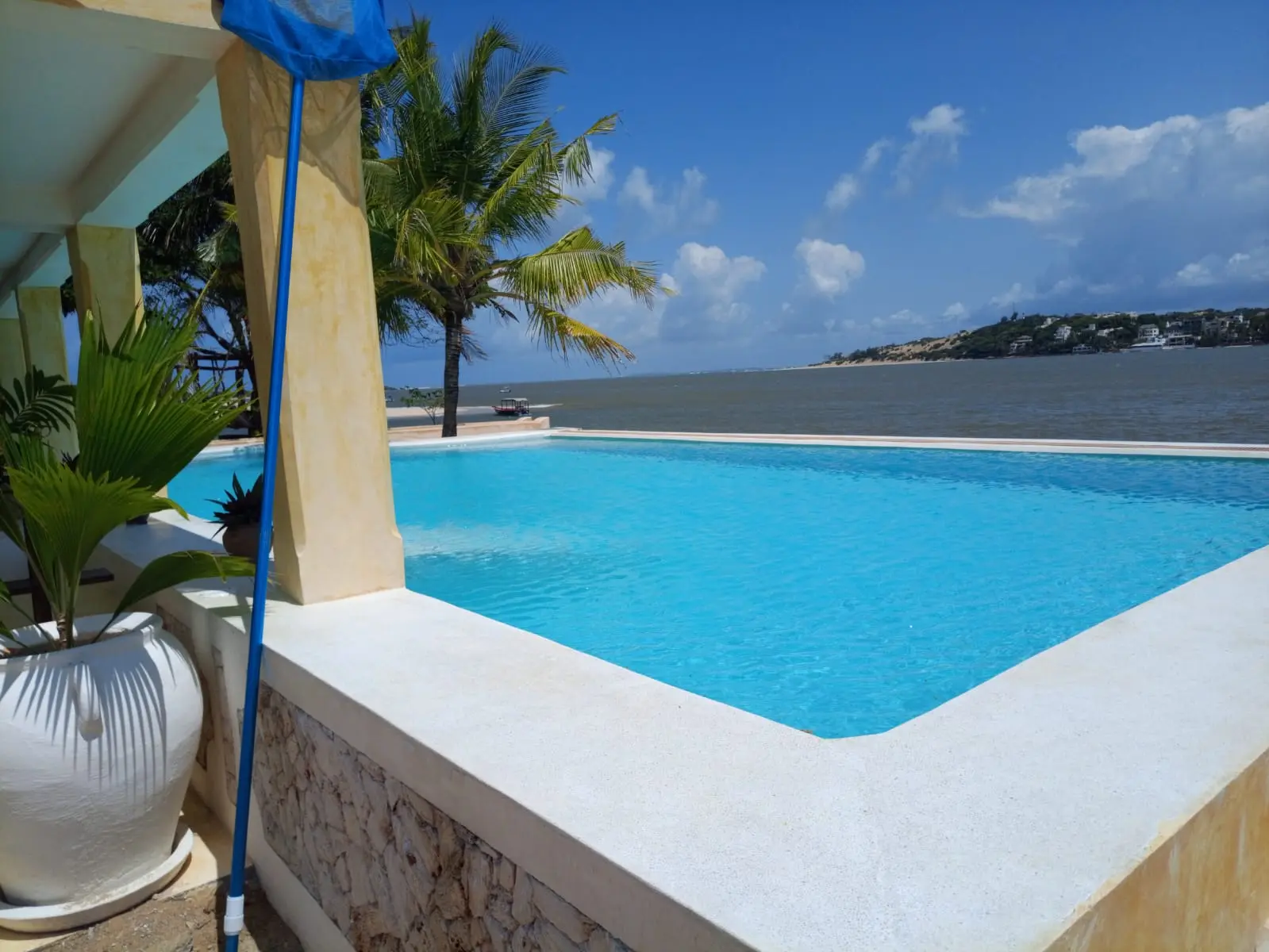 Stunning infinity pool with crystal blue water and panoramic ocean views