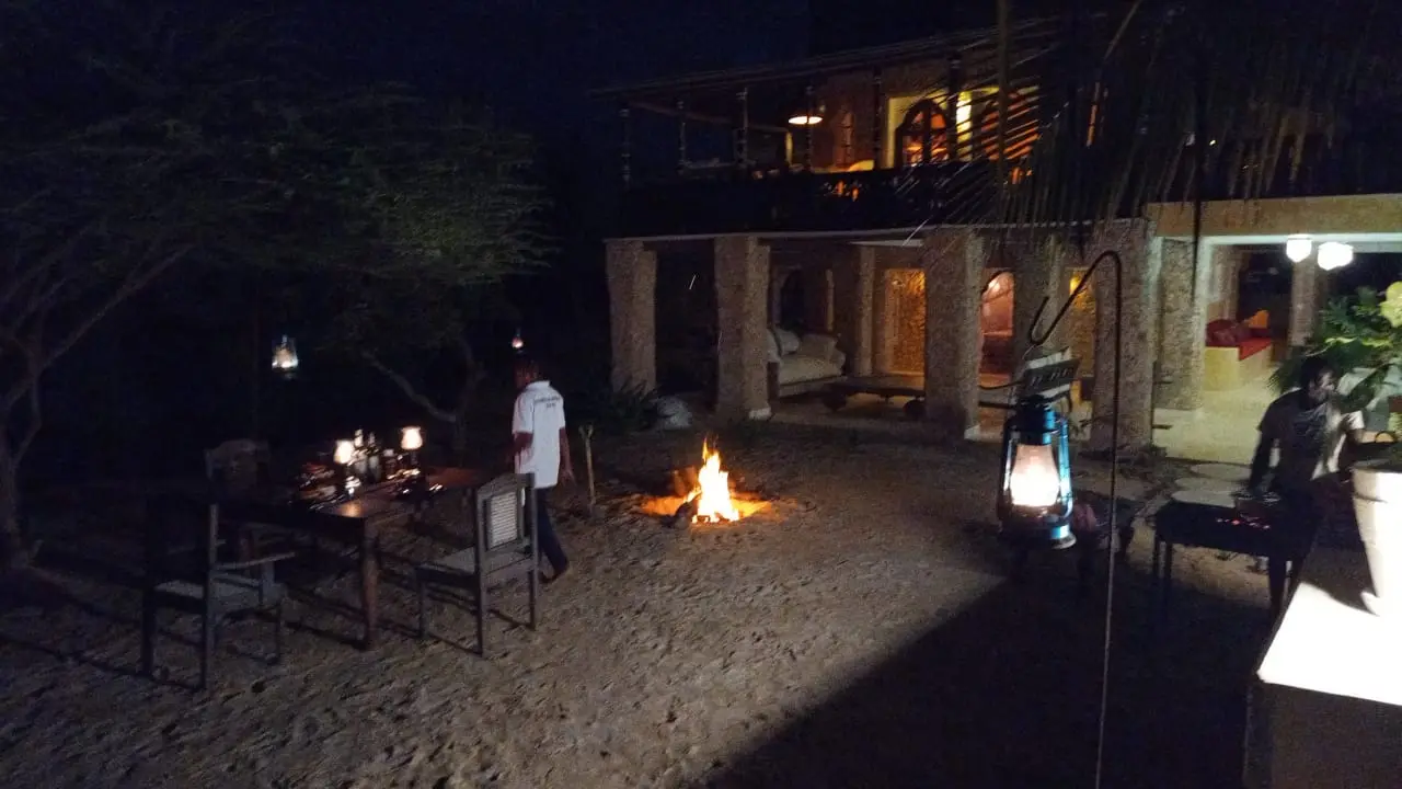 Staff providing evening service on the beach