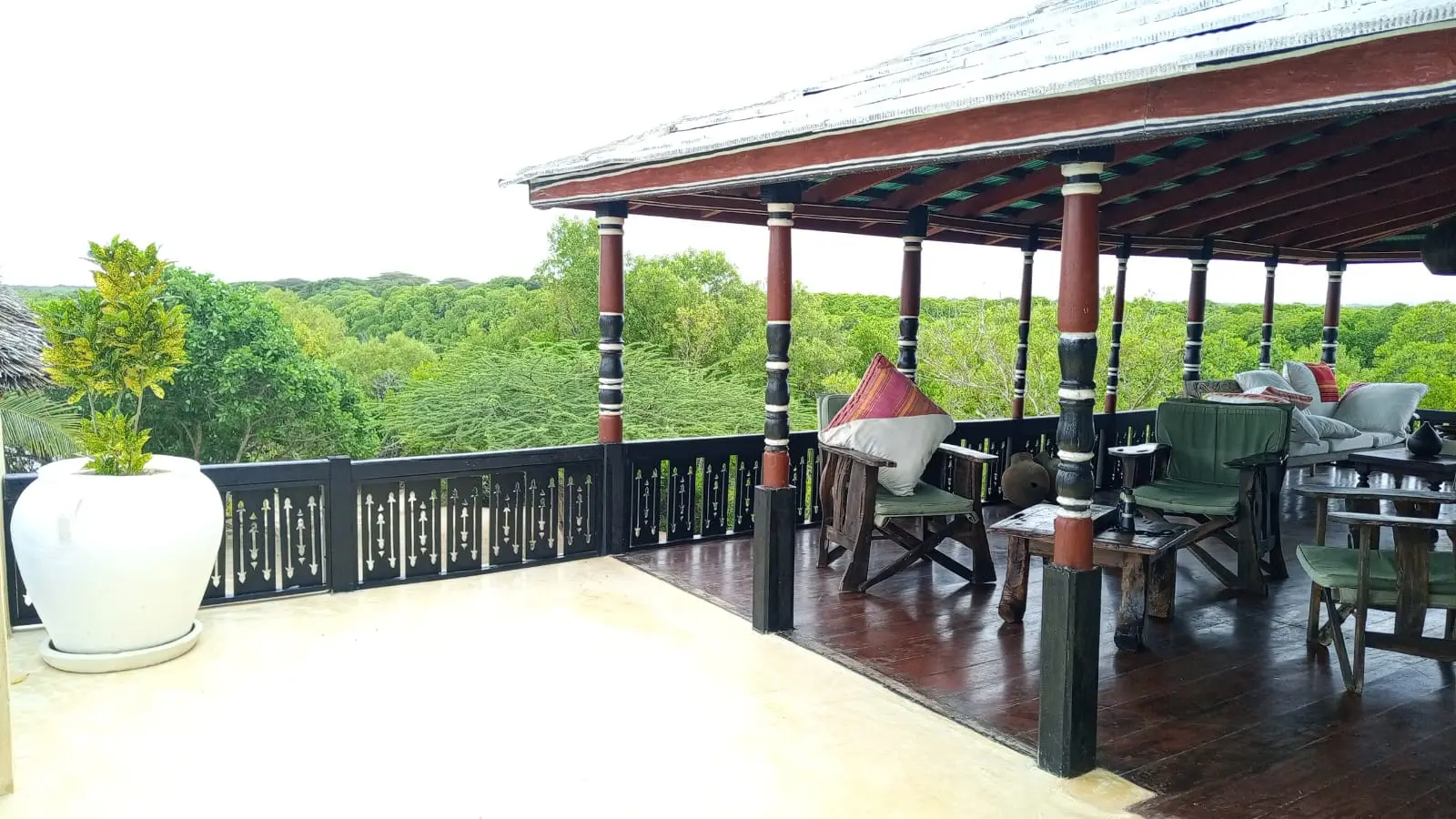 Upper level terrace with forest view and traditional columns