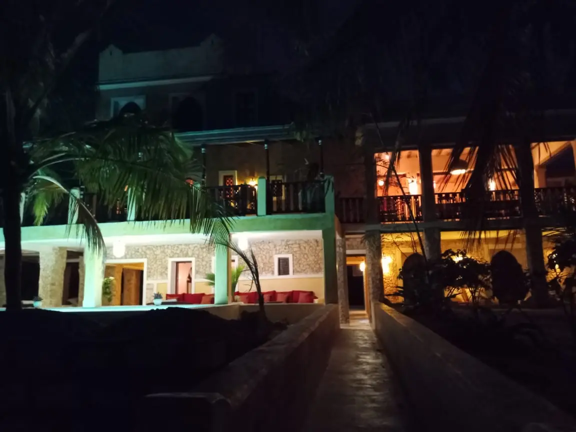 Villa with swimming pool and ocean view at night