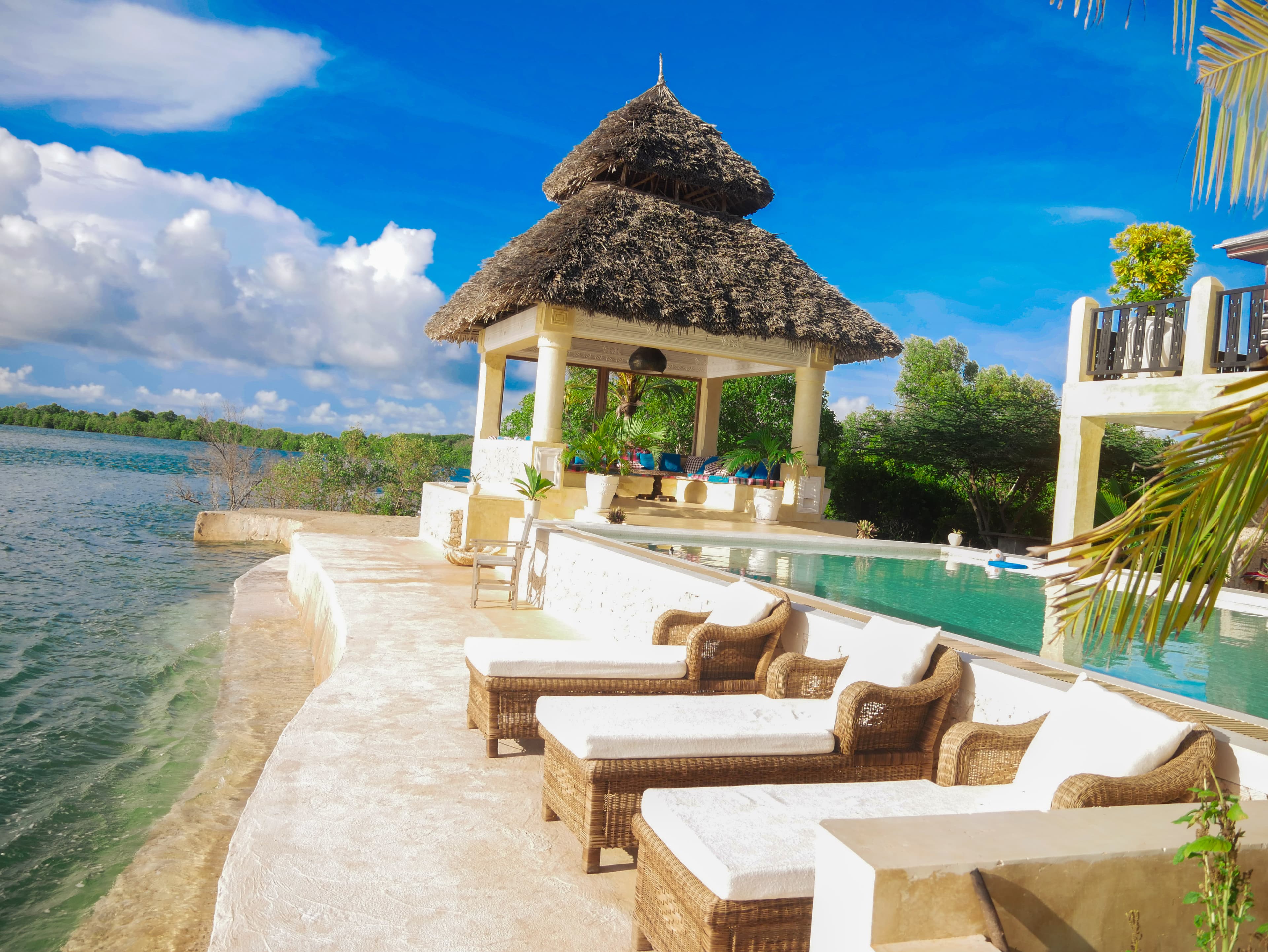 Gazebo, pool, resting area and ocean panorama