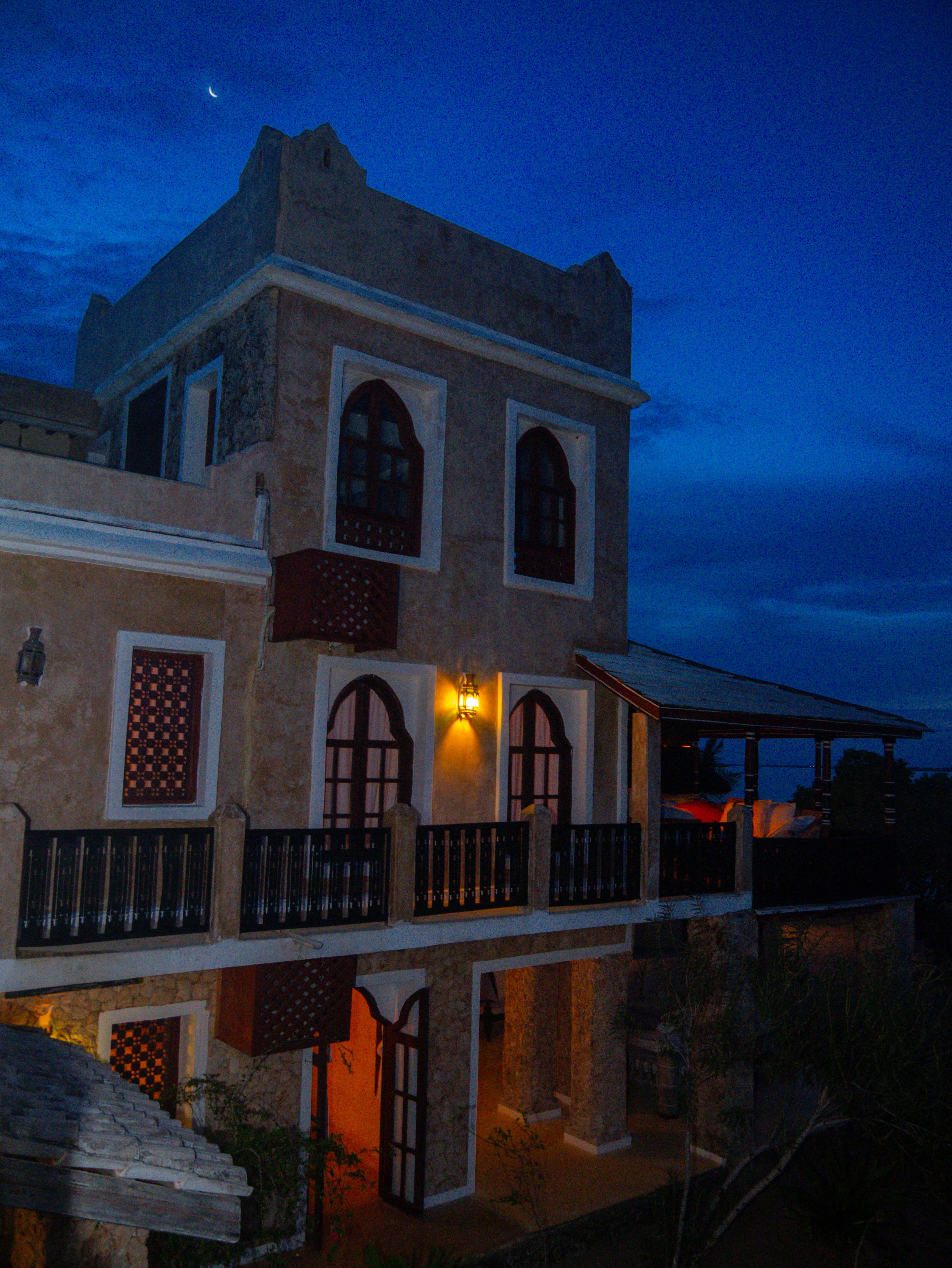 Front of villa at night with lighting