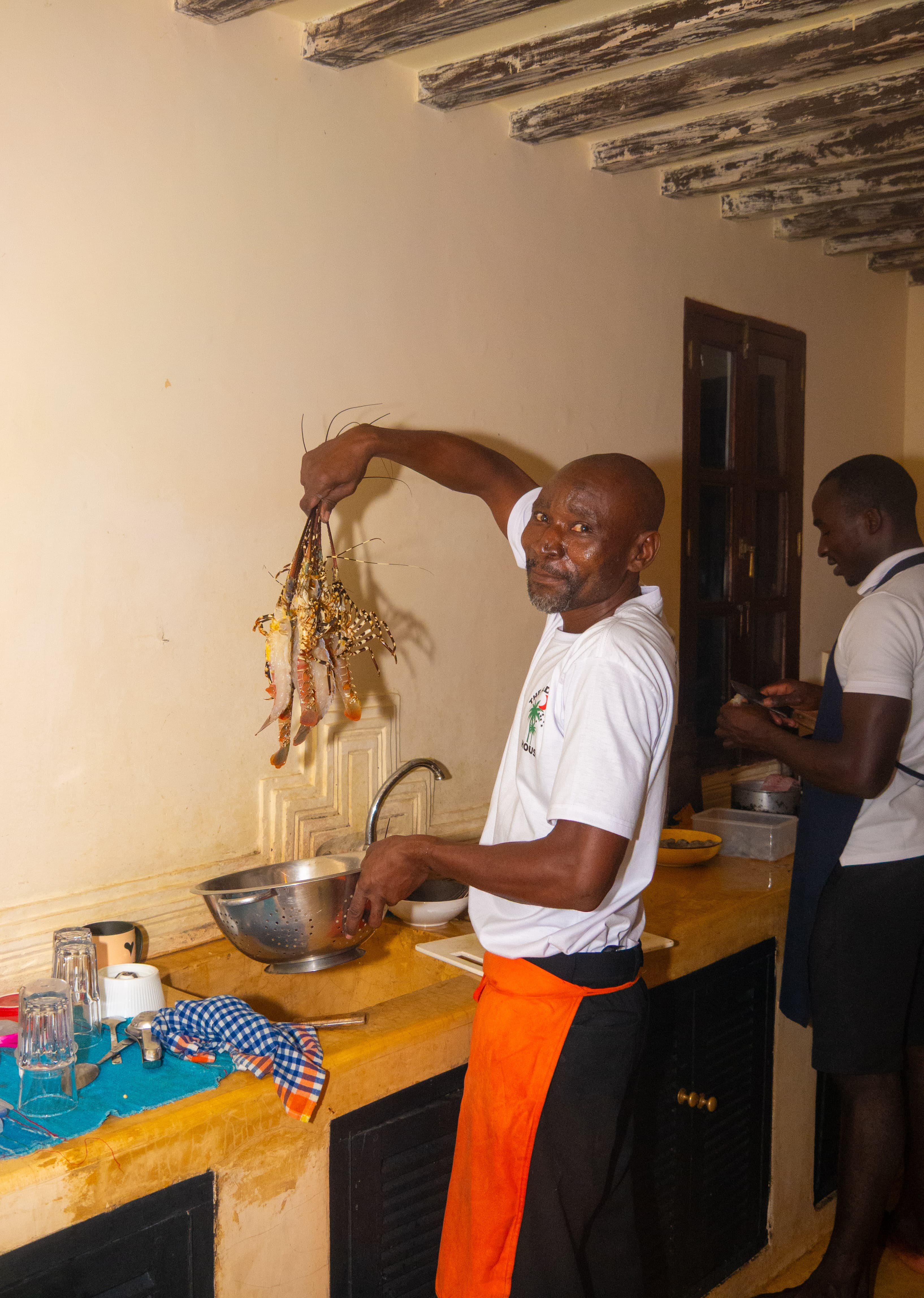 Staff showcasing fresh prawns